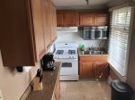 fully equipped kitchen, standard size fridge and coffee